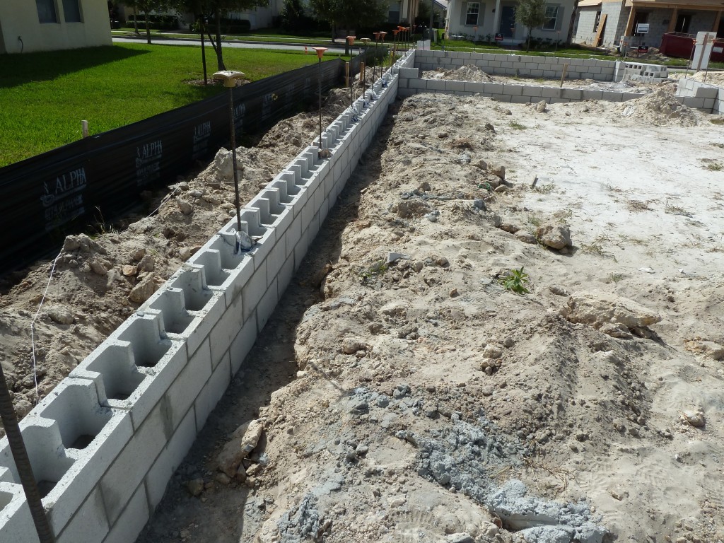 strip footing supporting CMU wall with vertical reinforcement steel