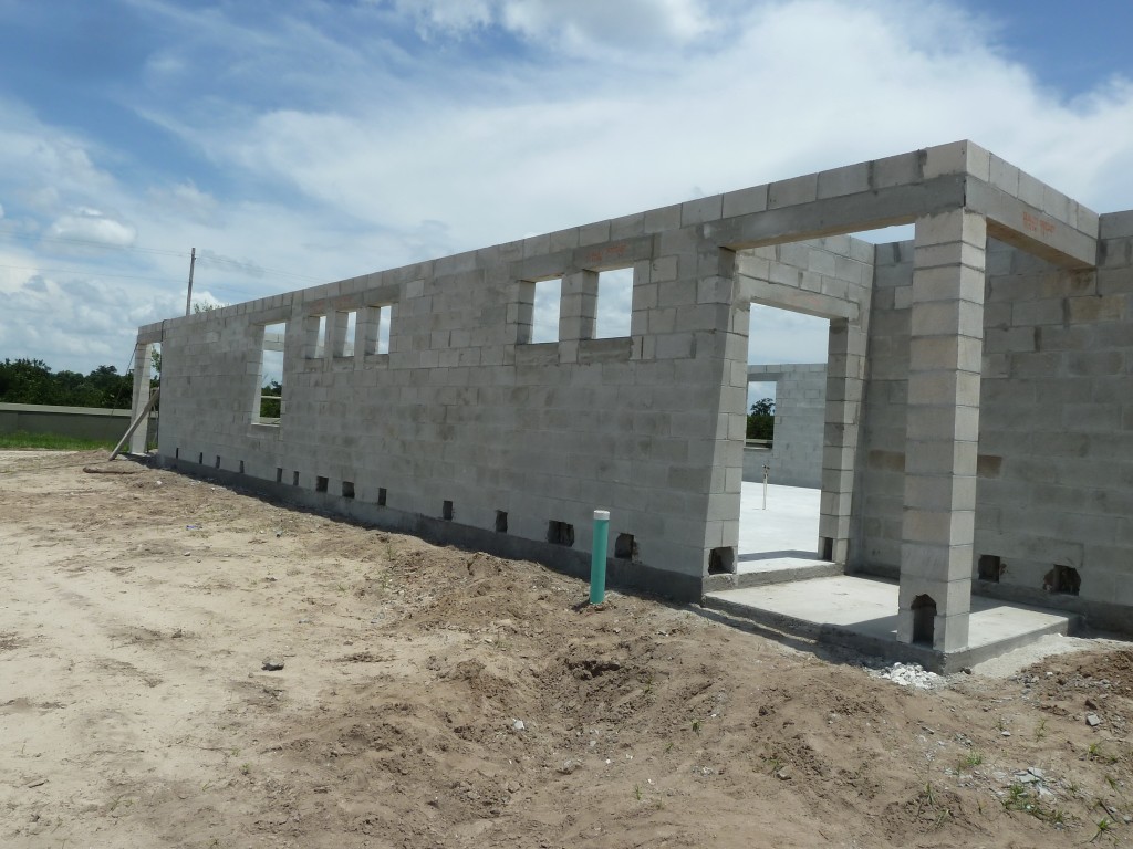 CMU wall under construction Reinforced CMU masonry concrete block wall under construction