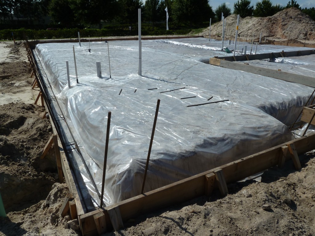 Slab on ground concrete slab on grade with 6 mil vapor retarder monolithic footing